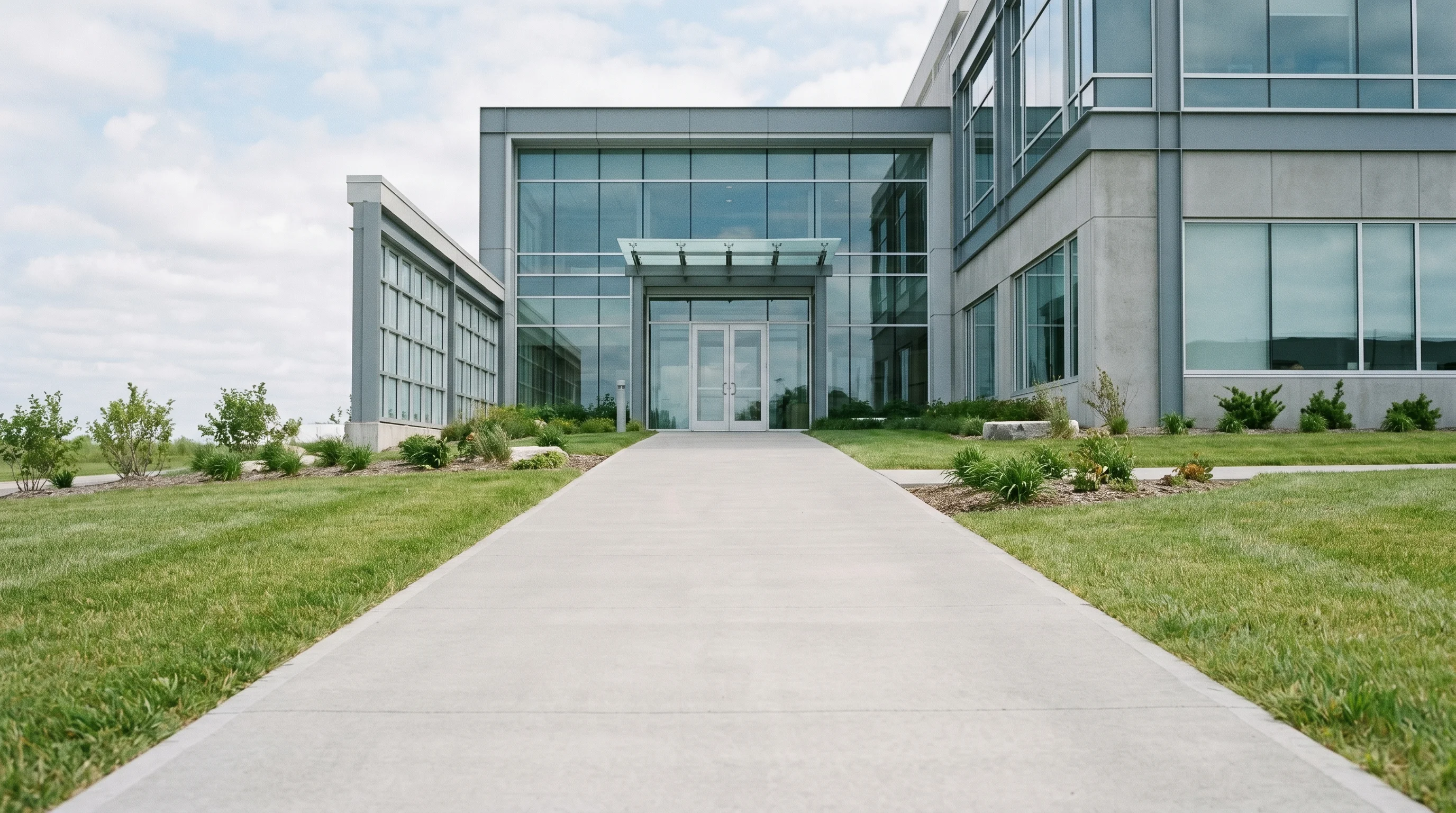 Digital illustration for article section "What's Clear, and What Isn't" in "YC-Backed Klaimee Launches Liability Insurance for AI Agents" - Generate a realistic image of a clear path leading up to a modern corporate building, symbolizing th...